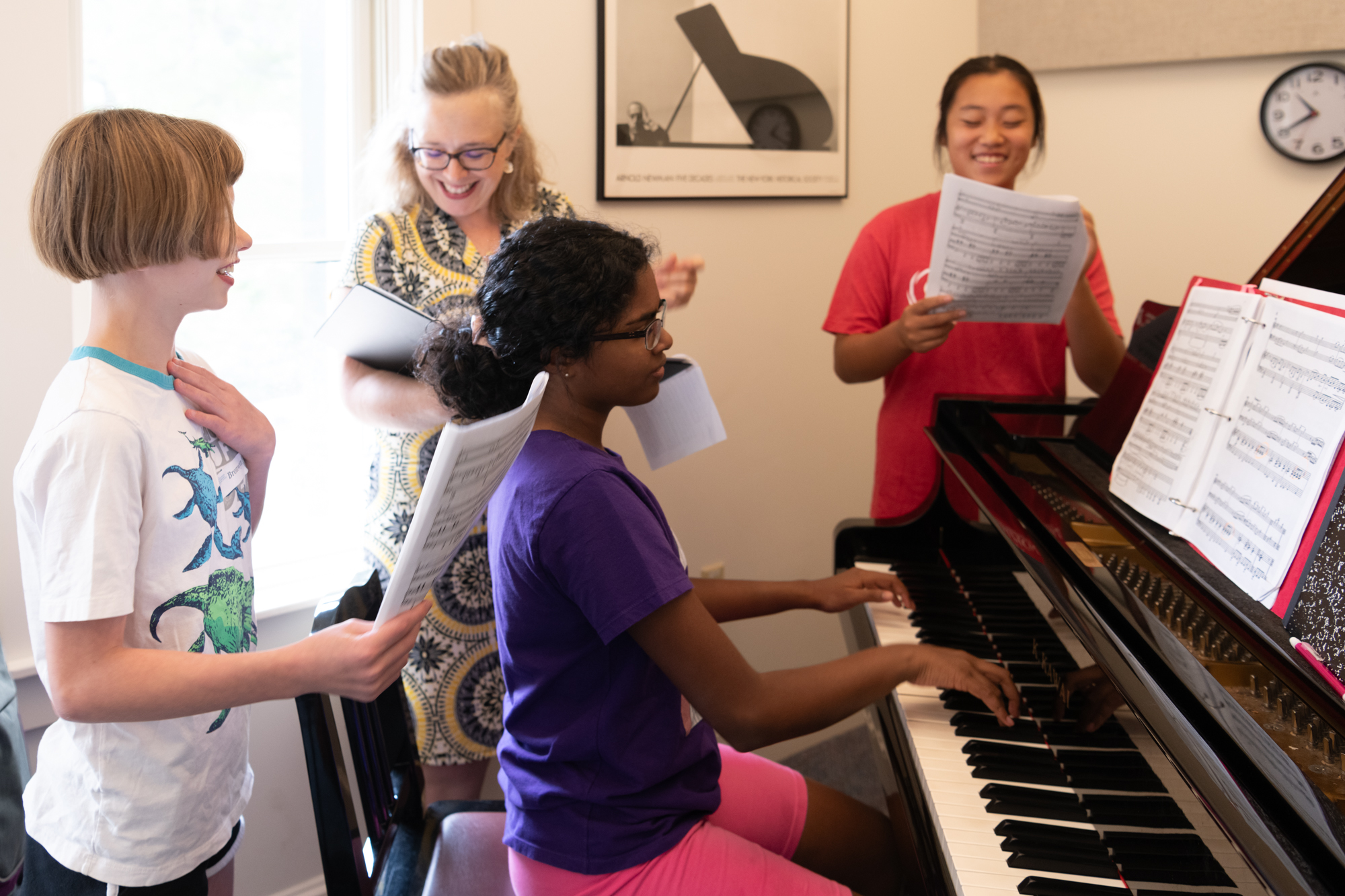 Voice coach with students and piano